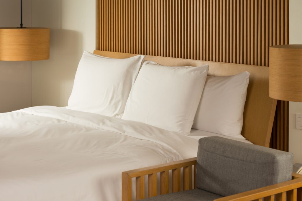 elegant hotel room with a cozy well made bed