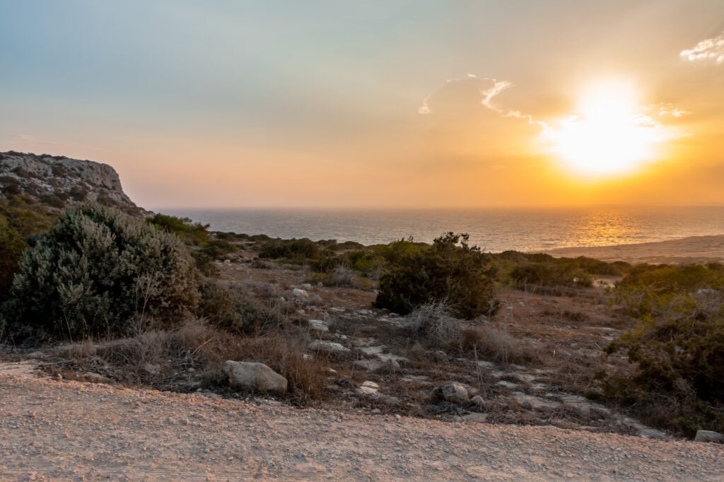 view of the sunset and the sea from cape greco on the island of cyprus